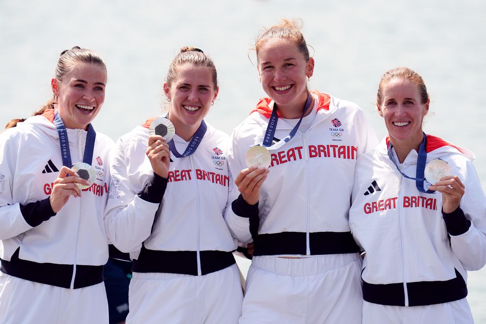 Great Britain’s Helen Glover, Esme Booth, Sam Redgrave and Rebecca Shorten receive their silver medals (John Walton/PA)