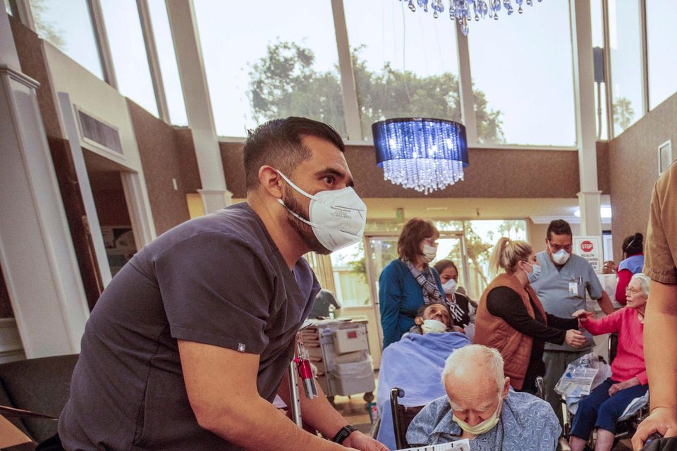 Residents are evacuated from a senior living facility (Ethan Swope/AP)