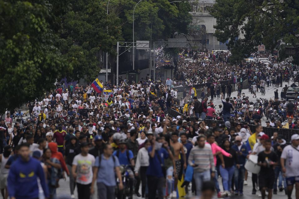 Protesters demonstrate against the official election results declaring President Nicolas Maduro the winner (Matias Delacroix/AP)