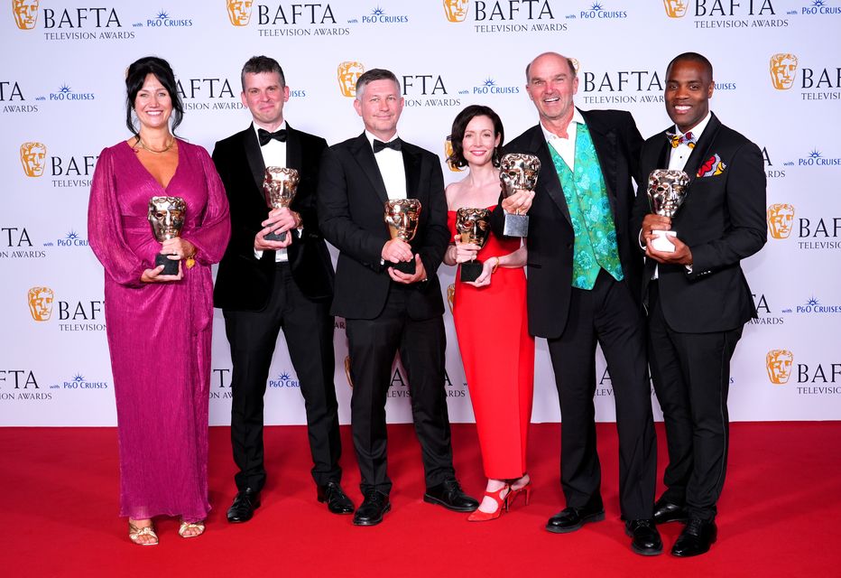 John Hay, Stephen Lambert, Toni Ireland and Stephen Yemoh in the press room after winning the Reality award for Squid Game: The Challenge at the BAFTA TV Awards 2024 (Ian West/PA)