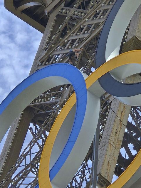 The man was spotted above the Olympic rings, just above the first viewing deck, before he was arrested (Nickey Worlock via AP)