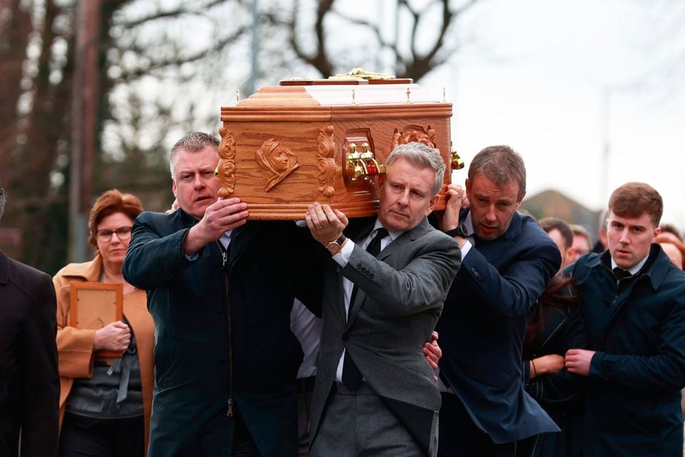 Patrick Kielty (right) carries the coffin of his mother Mary Kielty, to the Church of the Sacred Heart in Dundrum for her funeral. Photo Liam McBurney/PA Wire