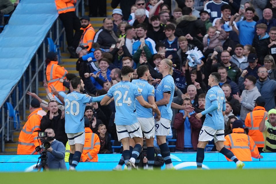 Erling Haaland, centre right, celebrates scoring his goal (Martin Rickett/PA)