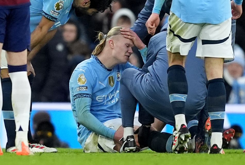 Erling Haaland receives treatment late on (Martin Rickett/PA)