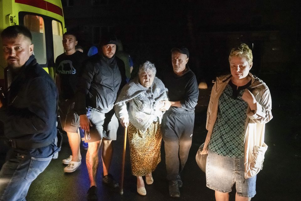 Residents leave an apartment building in Kursk, Russia, damaged by Ukrainian shelling (AP)