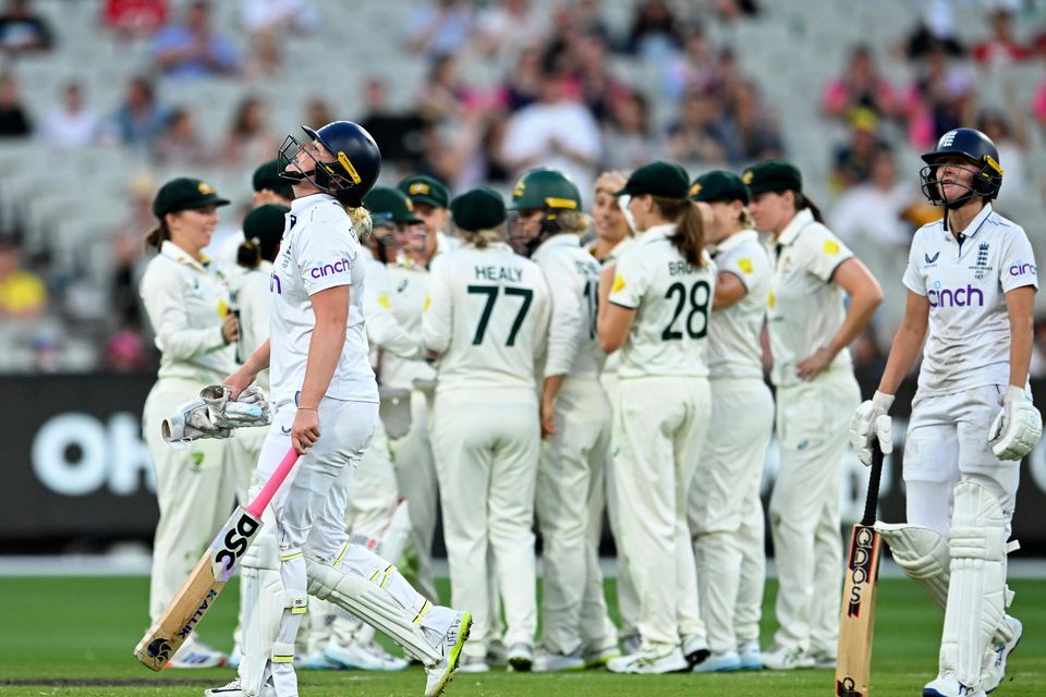 England’s Sophie Ecclestone (front left) walked off after losing her wicket in the day/night Ashes Test against Australia (James Ross/AAP via AP)