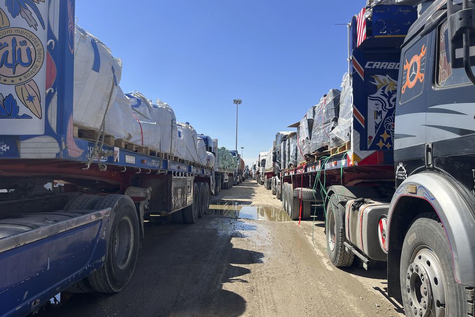 Trucks line up at the Egyptian side of the Rafah border crossing between Egypt and the Gaza Strip after Israel blocked the entry of aid trucks into Gaza (Mohamed Arafat/AP photo)