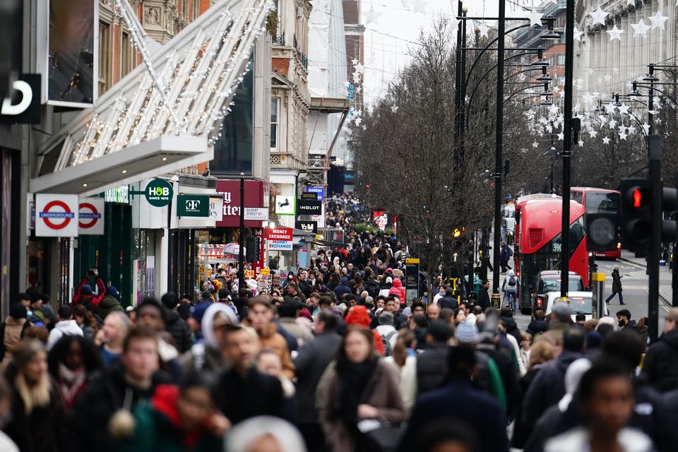 Boxing Day footfall was down 9.4% across all UK retail destinations by 12pm in comparison with last year, according to figures (Jordan Pettitt/PA)