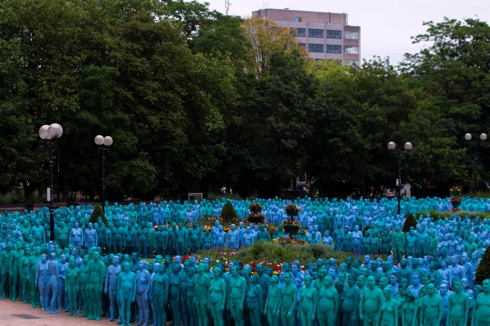 Naked volunteers, painted in blue to reflect the colours found in Marine paintings in Hull's Ferens Art Gallery, participate in US artist, Spencer Tunick's "Sea of Hull" installation in Queen's Gardens in Kingston upon Hull on July 9, 2016. AFP/Getty Images