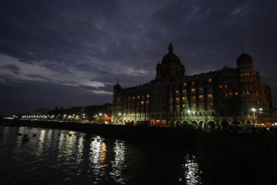 The landmark 565-room Taj Mahal hotel is seen after dawn in Mumbai, India, Saturday, Nov. 29, 2008. Indian commandos killed the last remaining gunmen holed up at a luxury Mumbai hotel Saturday, ending a 60-hour rampage through India's financial capital by suspected Islamic militants that killed people and rocked the nation. (AP Photo/Saurabh Das)