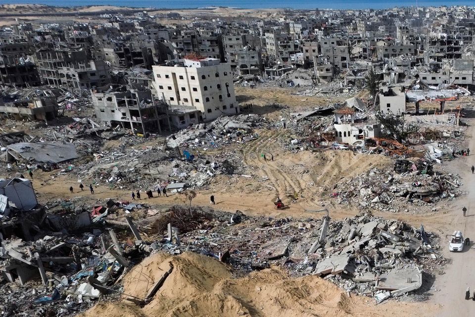 Many Palestinians did not wait for the ceasefire to come into effect before starting their treks home (Jehad Alshrafi/AP)