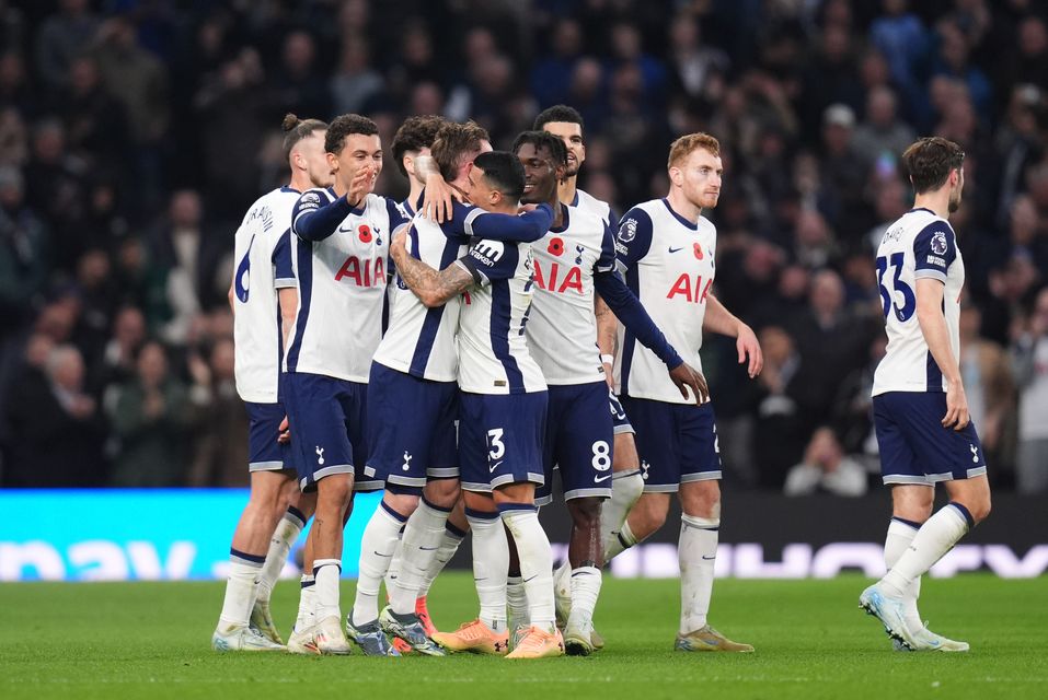 Spurs players celebrate their fourth goal (John Walton/PA)