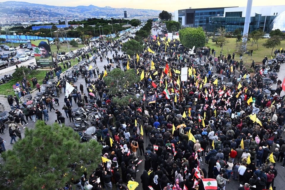 Hezbollah supporters protest near Beirut’s international airport (AP)