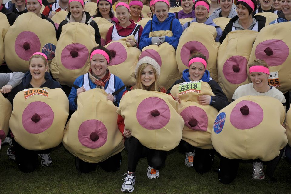 TV presenter Fearne Cotton (front centre) joins supporters of breast cancer charity CoppaFeel!, wearing giant boob costumes as they wait to take part in the Bath Half Marathon, where 100 supporters are taking part to raise money for the cancer charity (Ben Birchall/PA)