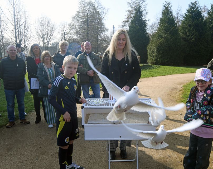 Doves are released during the Covid-19 Day of Reflection memorial event at Glasgow Green (Mike Boyd/PA)