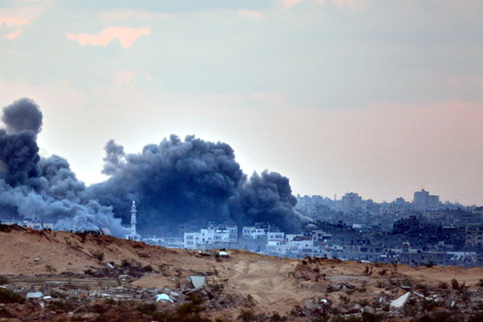 Smoke rises above Gaza after another Israeli air strike on a Hamas target, December 29, 2008 along Israel's side of the Gaza border. The Israeli Air Force continued its strike of the Hamas ruled Gaza Strip for a third consecutive day, killing 307 Palestinians in the air raids, as Israel prepared to launch a possible invasion.