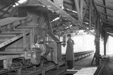 thumbnail: On a visit to the Gasworks an employee demonstrates the Coal Gripper (The feed system of a coal getting combine, which works with a face conveyor, comprises: a traction device located on the combine and having a cylinder-shaped sprocket on the side surface of which a circular spherical-shaped recess is provided, slots being made on both inner sides of the spherical recess, said slots having an involute-spherical surface)   20/1/1938