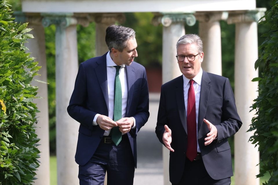 Taoiseach Simon Harris walks with Prime Minister Sir Keir Starmer at Farmleigh House (Peter Morrison/PA)