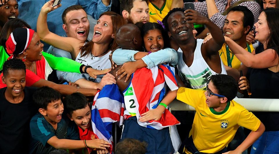 Britain's Mo Farah celebrates winning the Men's 5000m Final during the athletics event at the Rio 2016 Olympic Games at the Olympic Stadium in Rio de Janeiro on August 20, 2016. / AFP PHOTO / FRANCK FIFEFRANCK FIFE/AFP/Getty Images