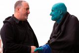 thumbnail: US artist Spencer Tunick (L), shakes hands with 80 year old Belgian, Arizona-based art collector Stephane Janssen who has participated in 20 of Turnick's installations after around 3000 naked volunteers, painted in blue to reflect the colours found in Marine paintings in Hull's Ferens Art Gallery, participate in US artist, Spencer Tunick's "Sea of Hull" installation on the Scale Lane swing bridge in Kingston upon Hull on July 9, 2016. AFP/Getty Images