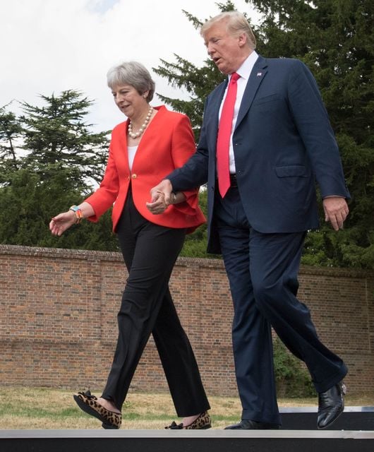 Donald Trump walks with Prime Minister Theresa May prior to a joint press conference at Chequers in 2018 (Stefan Rousseau/PA)