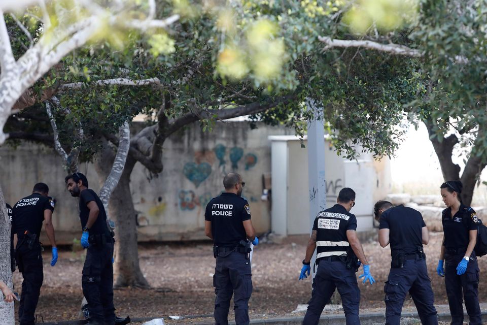 Israeli police inspect the scene of the knife attack (Tomer Appelbaum/AP)