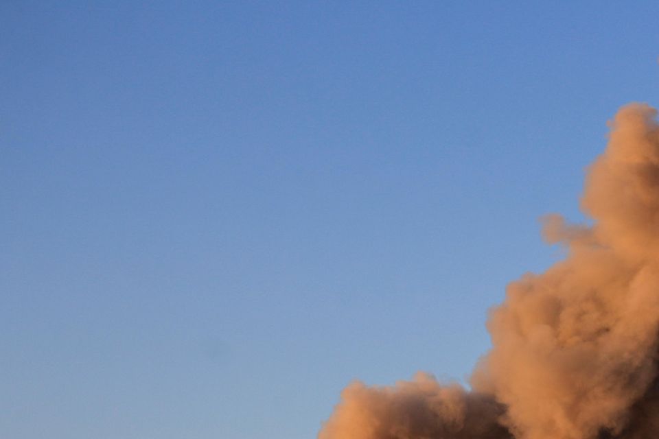 Smoke rises from a building hit in an Israeli air strike on southern Lebanon (Mohammed Zaatari/AP)