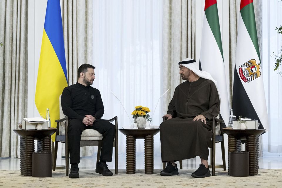 United Arab Emirates President Sheikh Mohammed bin Zayed Al Nahyan, right, and Ukrainian President Volodymyr Zelensky, left, met in Abu Dhabi on Monday (WAM/AP)