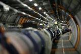 thumbnail: View of the LHC (large hadron collider) in its tunnel at CERN (European particle physics laboratory) near Geneva, Switzerland, Thursday, May 31, 2007. The LHC is a 27-kilometre-long underground ring of superconducting magnets housed in this pipe-like structure or cryostat. The cryostat is cooled by liquid helium to keep it at an operating temperature just above absolute zero. It will accelerate two counter-rotating beam of protons to an energy of 7 tera electron volts (TeV) and then bring them to collide head on. Several detectors are being built around the LHC to detect the various particles produced by the collision. A pilot run of the LHC is scheduled for summer 2007. (KEYSTONE/Martial Trezzini)