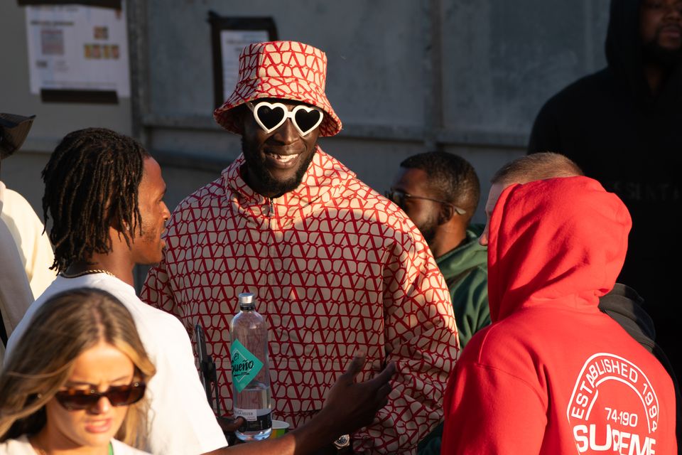 Stormzy watches D-Block Europe from the side of the stage at Glastonbury Festival at Worthy Farm in June (Ben Birchall/PA)