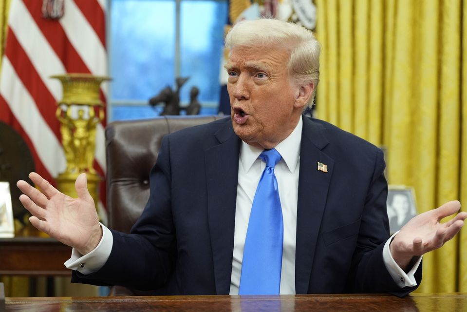 President Donald Trump speaks to reporters in the Oval Office (Alex Brandon/AP)