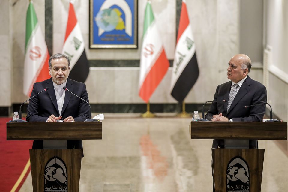 Abbas Araghchi, left, met Iraqi foreign minister Fouad Hussein in Baghdad earlier this month (Anmar Khalil/AP)