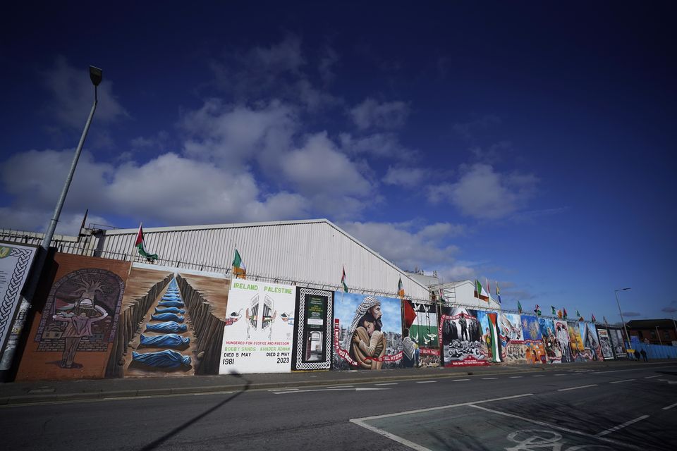 Murals on the International Wall in west Belfast in March 2024 (Niall Carson/PA)