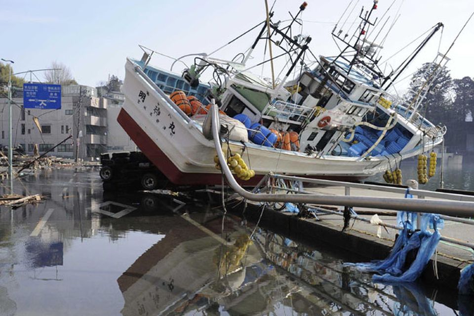 A fishing boat sits inland in Kesennuma, northern Japan Monday, March 14, 2011 following Friday's massive earthquake and the ensuing tsunami. (AP Photo/Kyodo News)  JAPAN OUT, MANDATORY CREDIT, NO SALES IN CHINA, HONG  KONG, JAPAN, SOUTH KOREA AND FRANCE