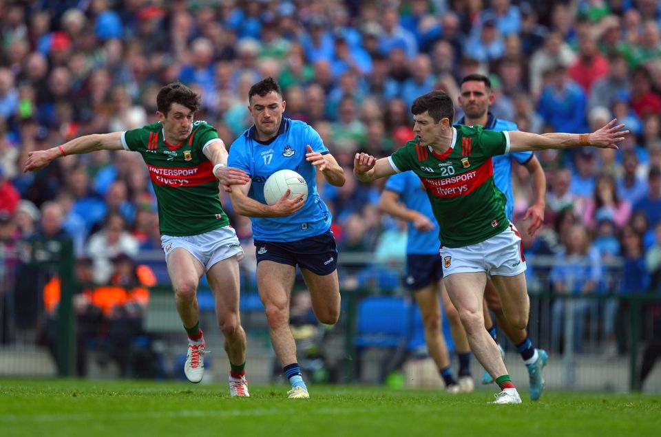 Dublin's Colm Basquel is tackled by Mayo's Jack Coyne, left, and Conor Loftus during the All-Ireland SFC Round 3 match at Dr Hyde Park in June. Photo: Ray McManus/Sportsfile