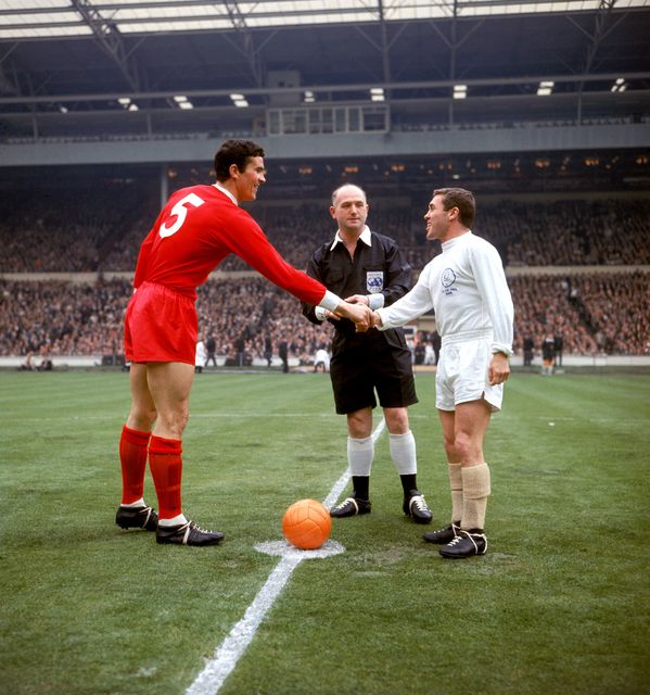 Bill Shankly’s ‘colossus’ Ron Yeats (left) was the first Liverpool captain to lift the FA Cup after beating Leeds – captained by Bobby Collins –  in the 1965 final (PA)