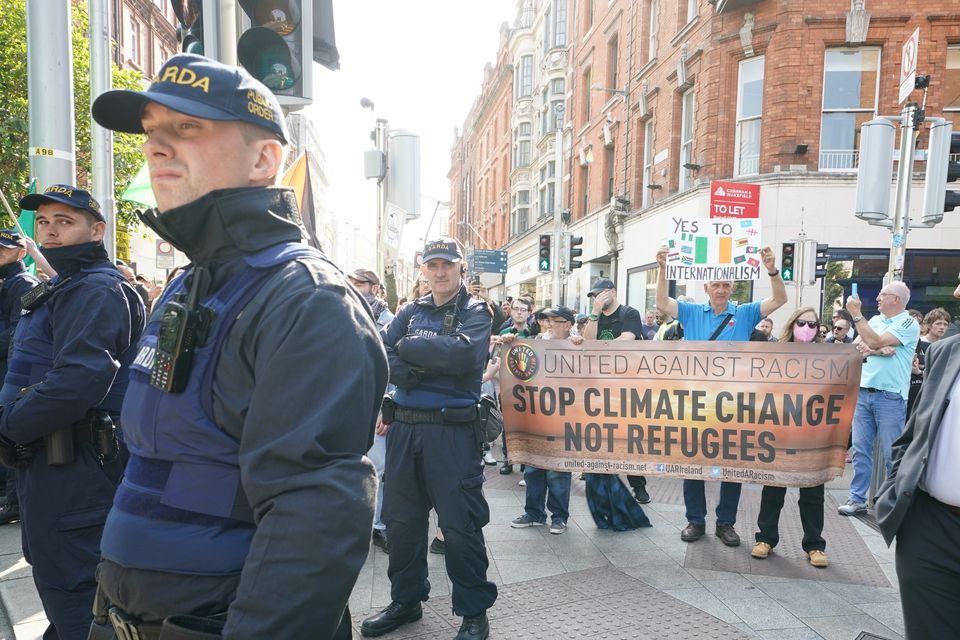 Counter-protesters in Grafton Street in Dublin city centre during an anti-immigration protest (Brian Lawless/PA)