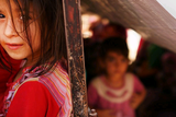 thumbnail: An Iraqi child waits with her family to get into a temporary displacement camp for Iraqis caught-up in the fighting in and around the city of Mosul on June 26, 2014 in Khazair, Iraq. (Photo by Spencer Platt/Getty Images)