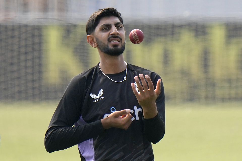 England’s Shoaib Bashir juggles the ball (Anjum Naveed/AP)