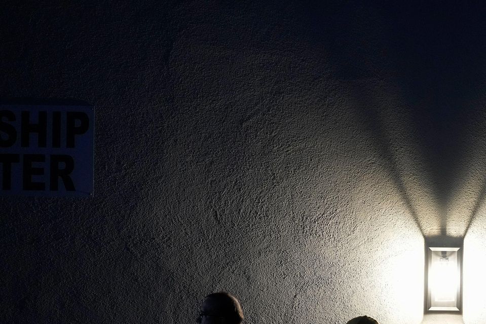 Voters stand in line outside a polling place at Madison Church in Phoenix, Arizona (Matt York/AP)