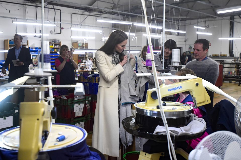 The Princess of Wales spends time with members of the production team on the factory floor during a visit to Corgi, a textiles manufacturer in Ammanford, South Wales (Rebecca Naden/PA)