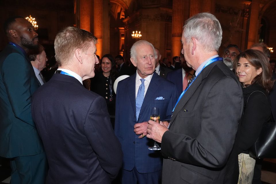 King Charles talking to guests during a reception for international business leaders (Lucy North/PA)