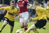 thumbnail: Outnumbered: Antrim's Jack McCourt and Dylan Davidson close in on Swindon's Mason Hathaway