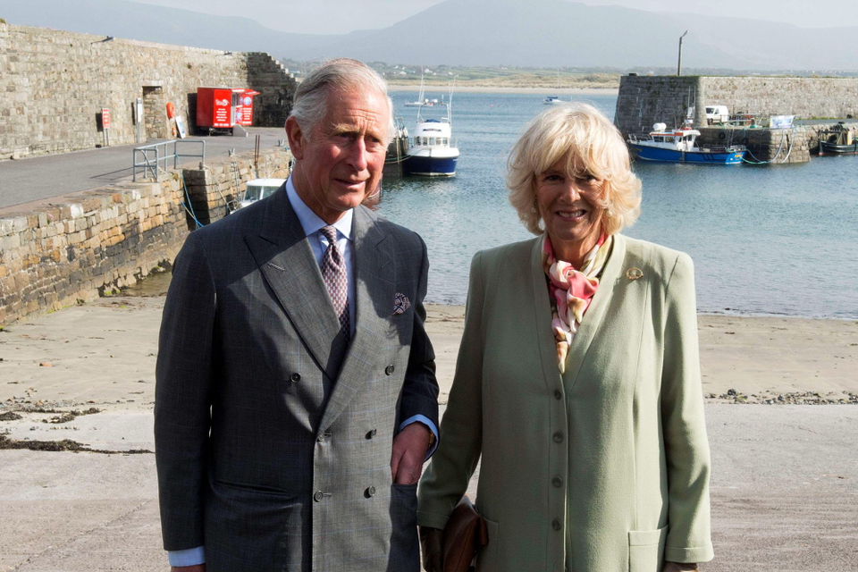 Britain's Prince Charles, Prince of Wales (L) and his wife Camilla, Duchess of Cornwall (R) visit the harbour in the village of Mullaghmore in Ireland on May 20, 2015 where the prince's great-uncle Lord Mountbatten was killed in an IRA explosion in 1979.