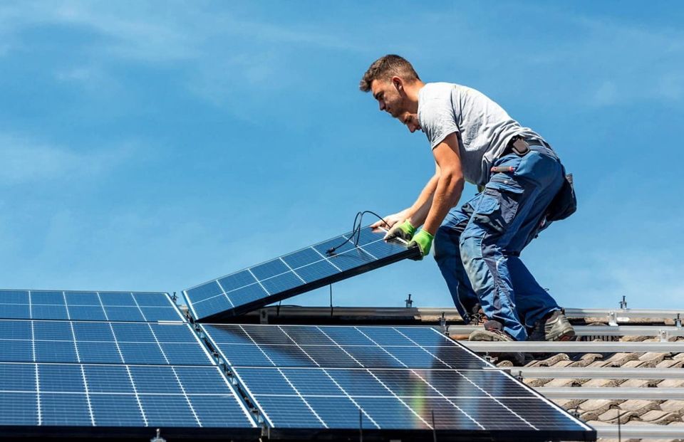 Solar panels being fitted to a home