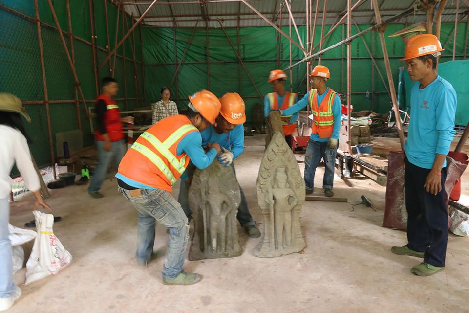 Statues being arranged at Angkor Thom (Phouk Chea/Apsaras National Authority via AP)