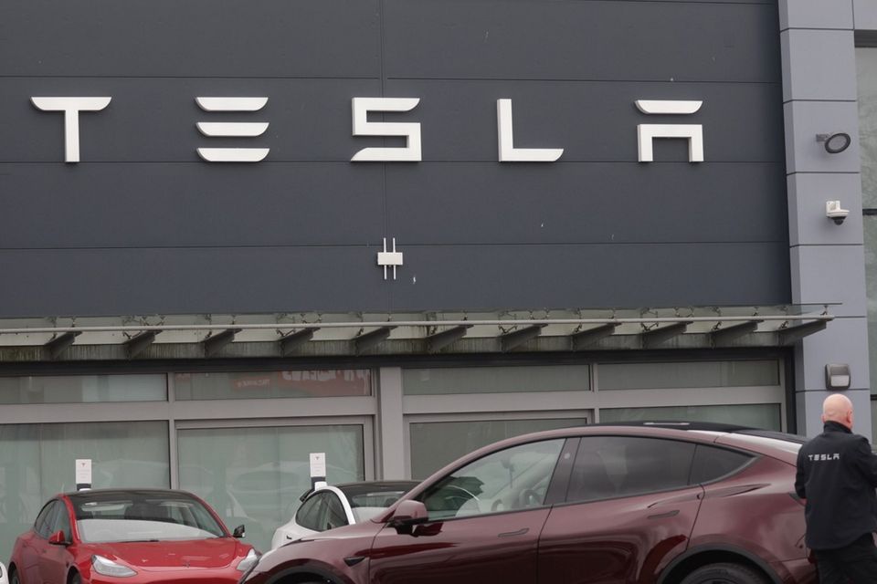 Around 20 cars were damaged at a Tesla dealership in Belfast. Photo by Pacemaker