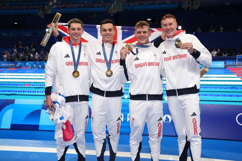 Tom Dean, right, made history earlier this week alongside Duncan Scott, James Guy and Matt Richards (John Walton/PA)