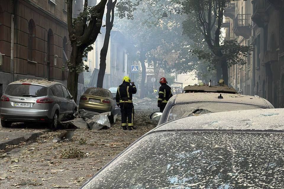 Firefighters work near a residential building damaged by a Russian strike in Lviv on Wednesday (Lviv City Council via AP)