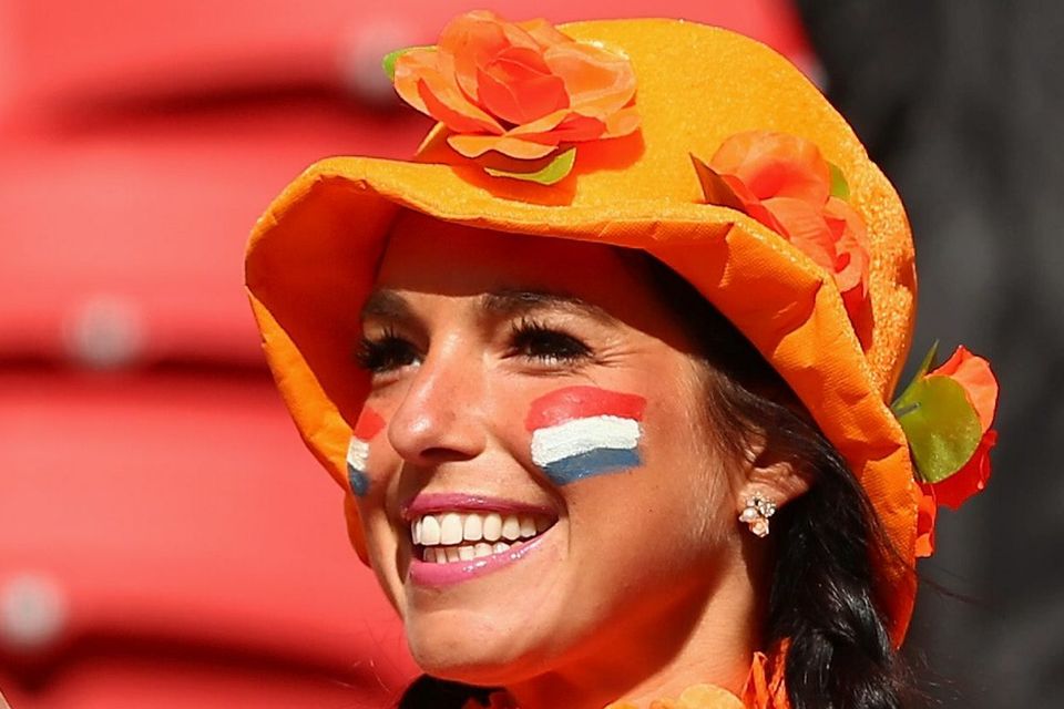 The beautiful game - football fans from around the world -   A fan of the Netherlands enjoys the atmosphere prior to the 2014 FIFA World Cup Brazil Group B match between Australia and Netherlands at Estadio Beira-Rio on June 18, 2014 in Porto Alegre, Brazil.  (Photo by Quinn Rooney/Getty Images)